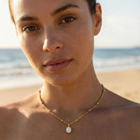 Thumbnail for Opal Pendant Necklace by Brother & Sisters featuring AAA-grade opal in gold prongs on a delicate chain.