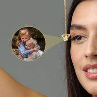 Thumbnail for Angel Photo Necklace featuring angel wings design, worn by a model with a cherished photo locket.