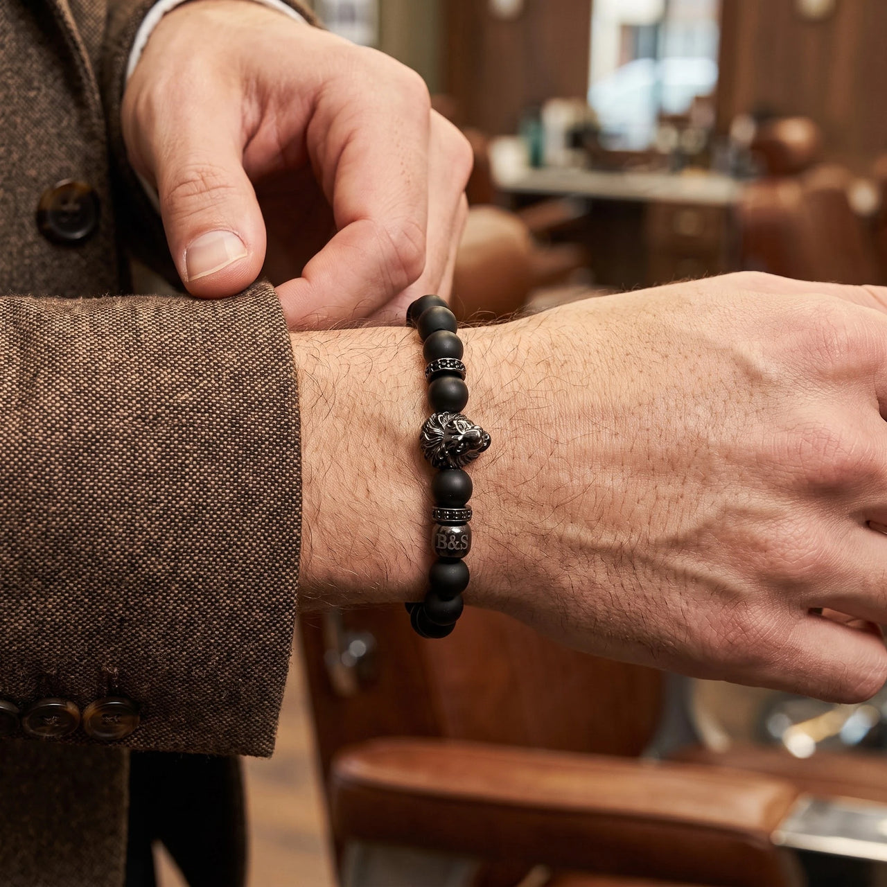 Black Lion & Black Stones Bracelet – worn with a shirt cuff | Brother & Sisters | SKU: 20712286-gun-black-XS-14-15, 20712286-gun-black-S-16-17, 20712286-gun-black-M-18-19, 20712286-gun-black-L-20-21, 20712286-gun-black-XL-22-23