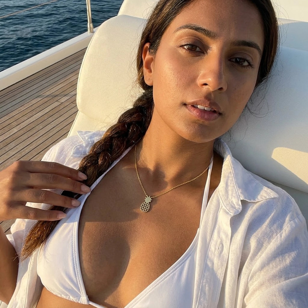 Woman on a yacht wearing the gold necklace | SKU: 8050907-gold