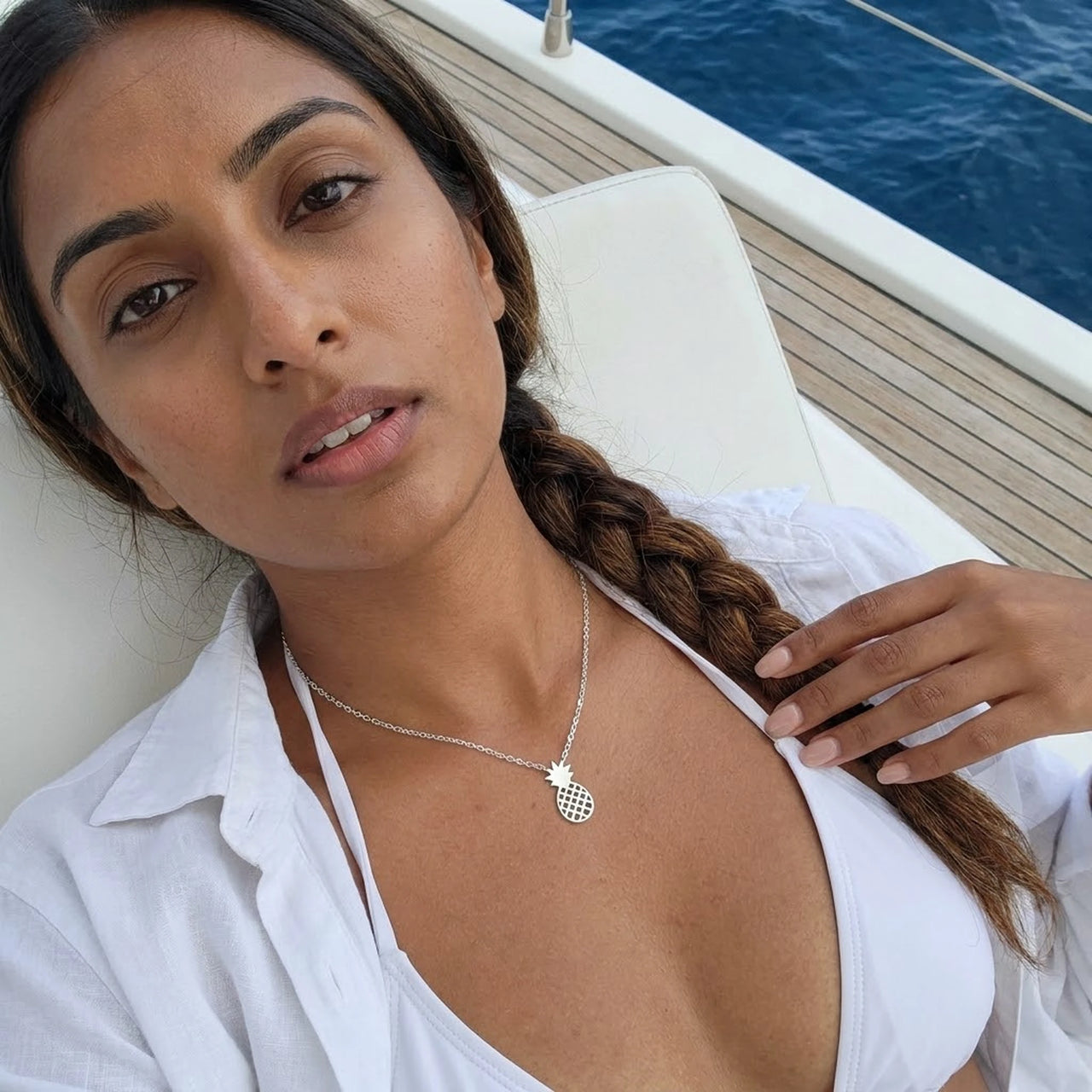 Woman on a yacht wearing the silver necklace | SKU: 8050907-white-gold