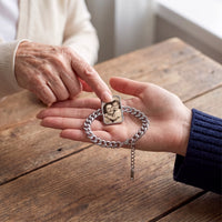 Thumbnail for An elderly mother's fingertip on the silver cushion-cut photo bracelet in her daughter's palm, showing their mother-and-daughter photo | SKU: TPH-CUSB-SILVER
