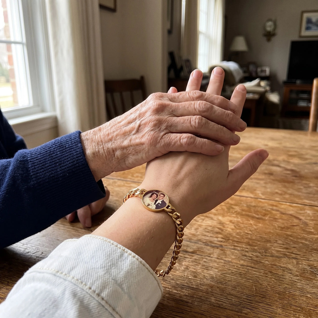 Grandmother's hand on her granddaughter's, the gold round photo bracelet with their wedding photo | SKU: TPH-RNDB-GOLD