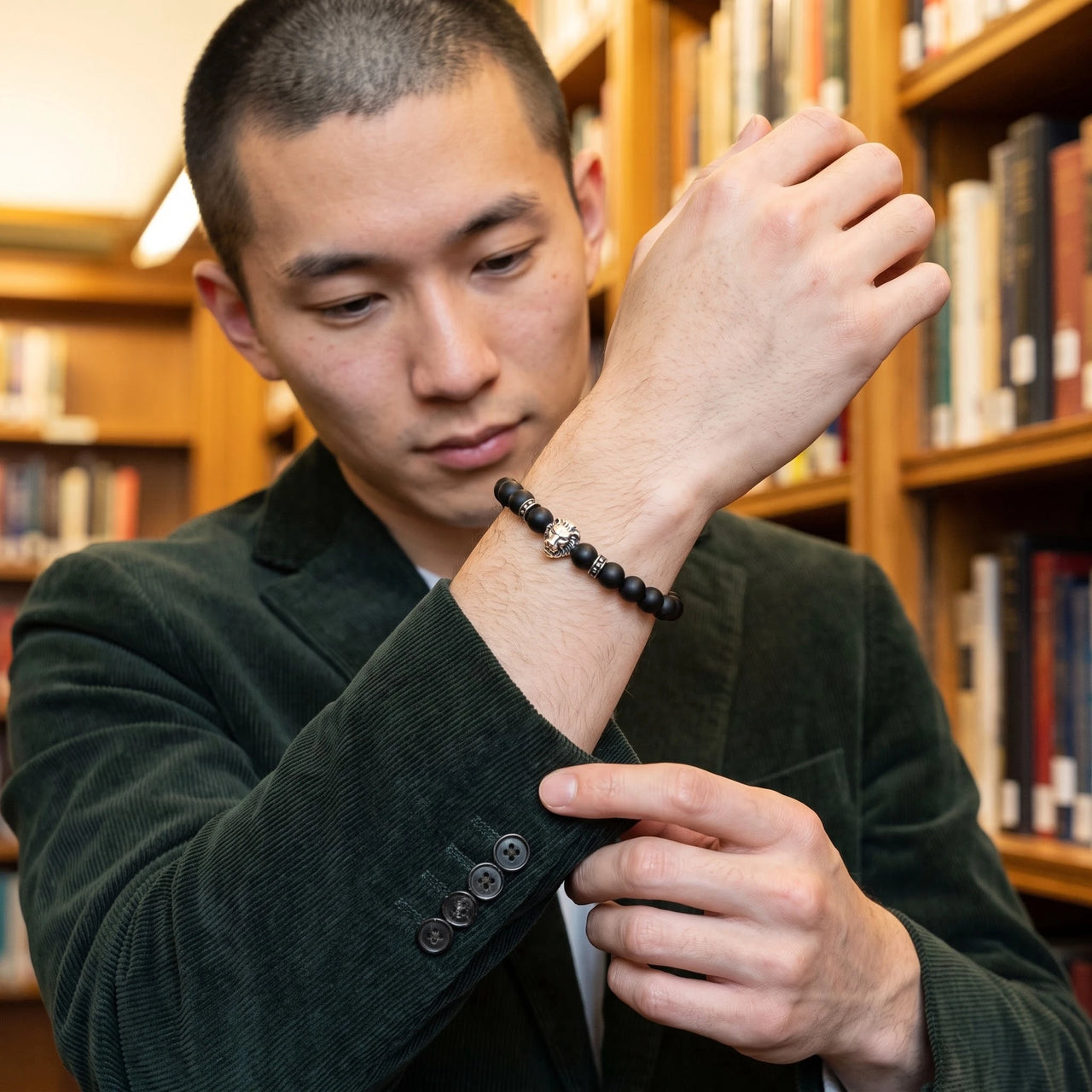 White Gold Lion & Black Stones Bracelet – worn with a shirt cuff | Brother & Sisters | SKU: 20712286-silver-XS-14-15, 20712286-silver-S-16-17, 20712286-silver-M-18-19, 20712286-silver-L-20-21, 20712286-silver-XL-22-23